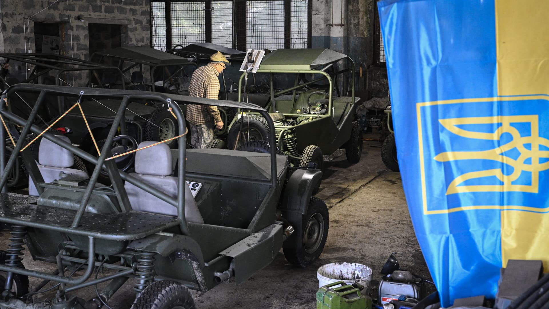 A workers assembles a buggy in a workshop in Kryvyi Rih on September 29, 2022, amid the Russian invasion of Ukraine.