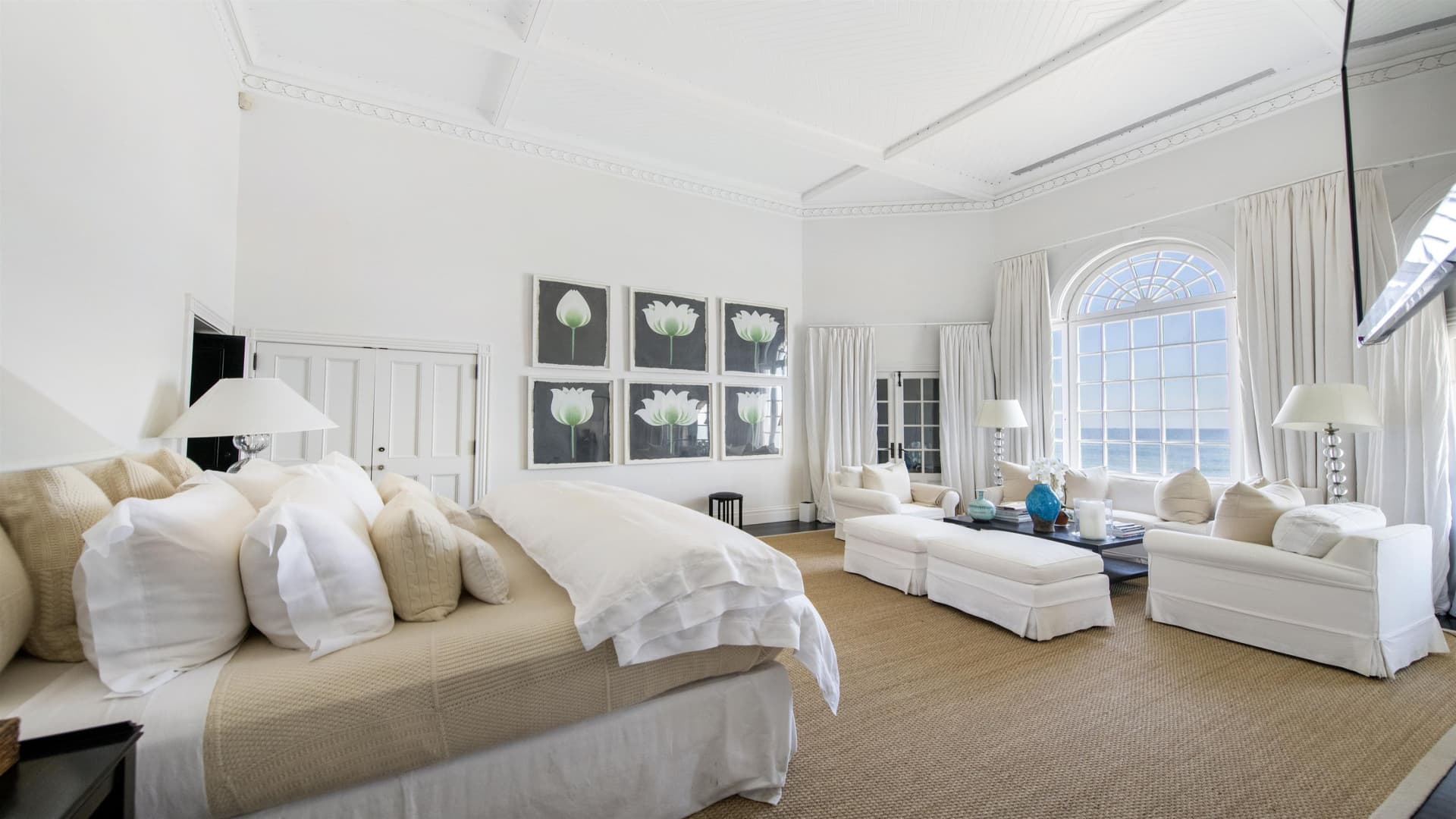 The main home's third-floor primary suite delivers impressive ocean views.