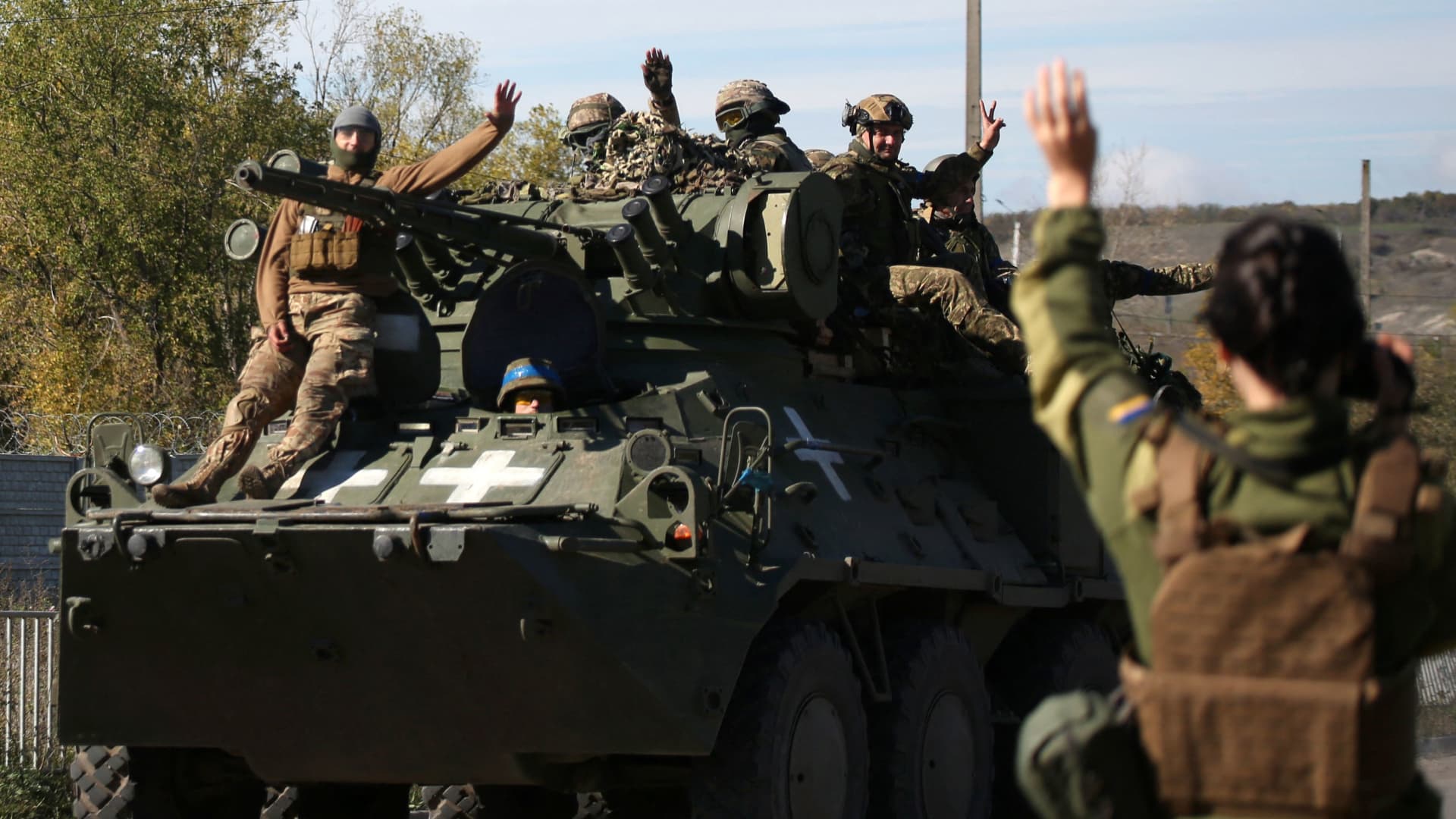Ukrainian soldiers on a personnel armored carrier on a road in the Donetsk region on Oct. 5, 2022, amid the Russian invasion of Ukraine.