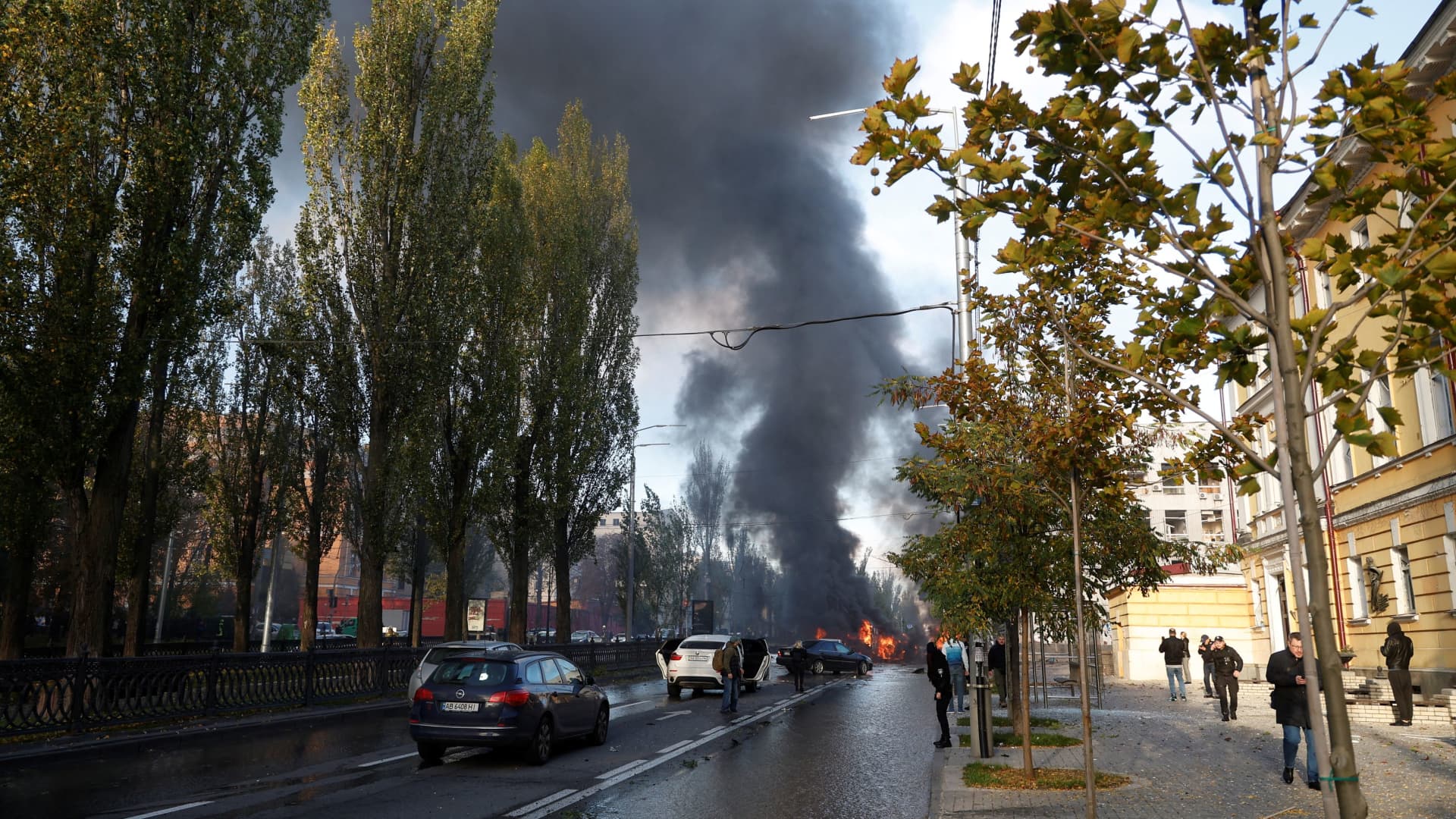 Cars are seen on fire after Russian missile strikes, as Russia's attack continues, in Kyiv, Ukraine October 10, 2022.