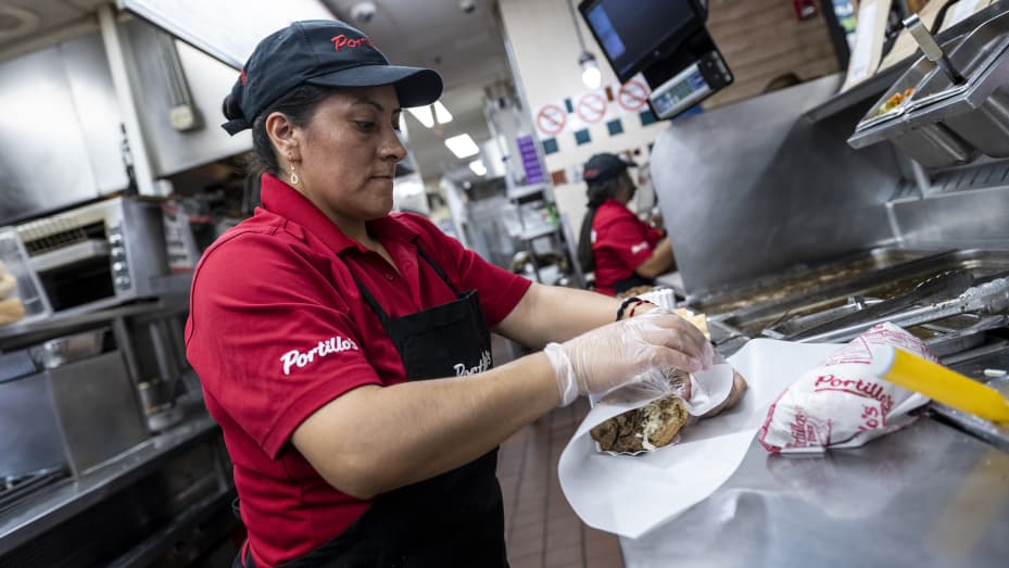 A worker wraps a beef sandwich at a Portillo's restaurant in Chicago, Illinois, US, on Tuesday, Sept. 27, 2022.