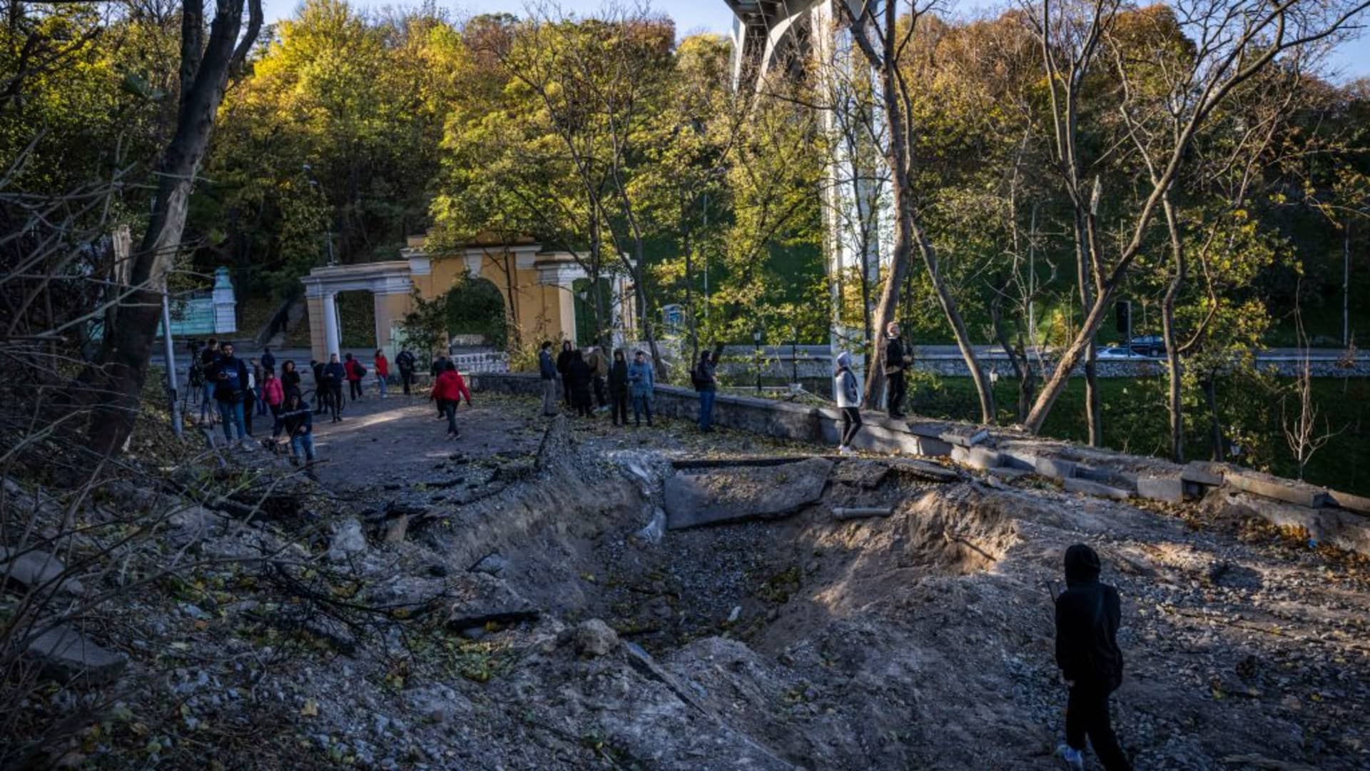 The site of a blast beside a pedestrian bridge overlooking the Dnipro River in the city center on Oct. 10, 2022 in Kyiv, Ukraine.
