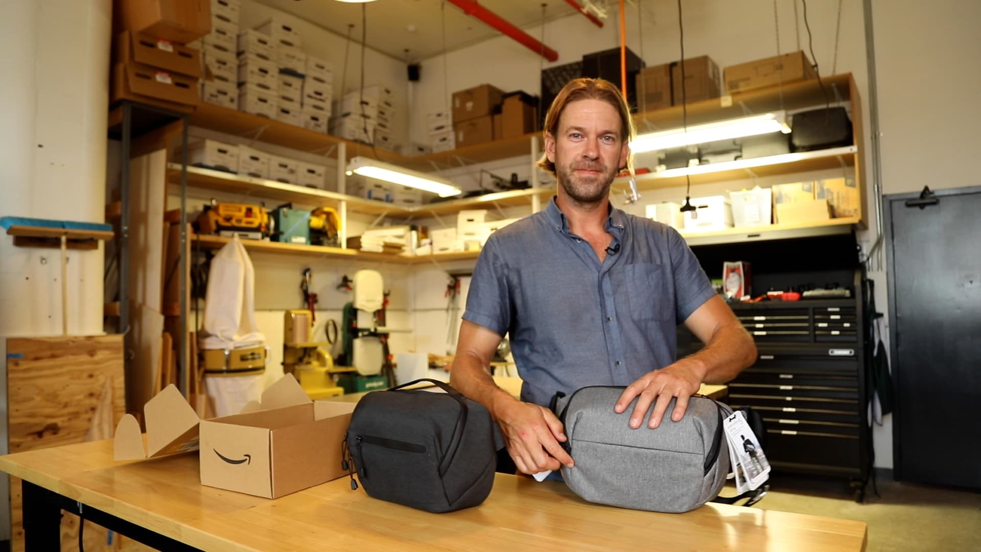 Peak Design CEO Peter Dering compares his company's Everyday Sling Bag to the Amazon private label version at his San Francisco headquarters on September 6, 2022.