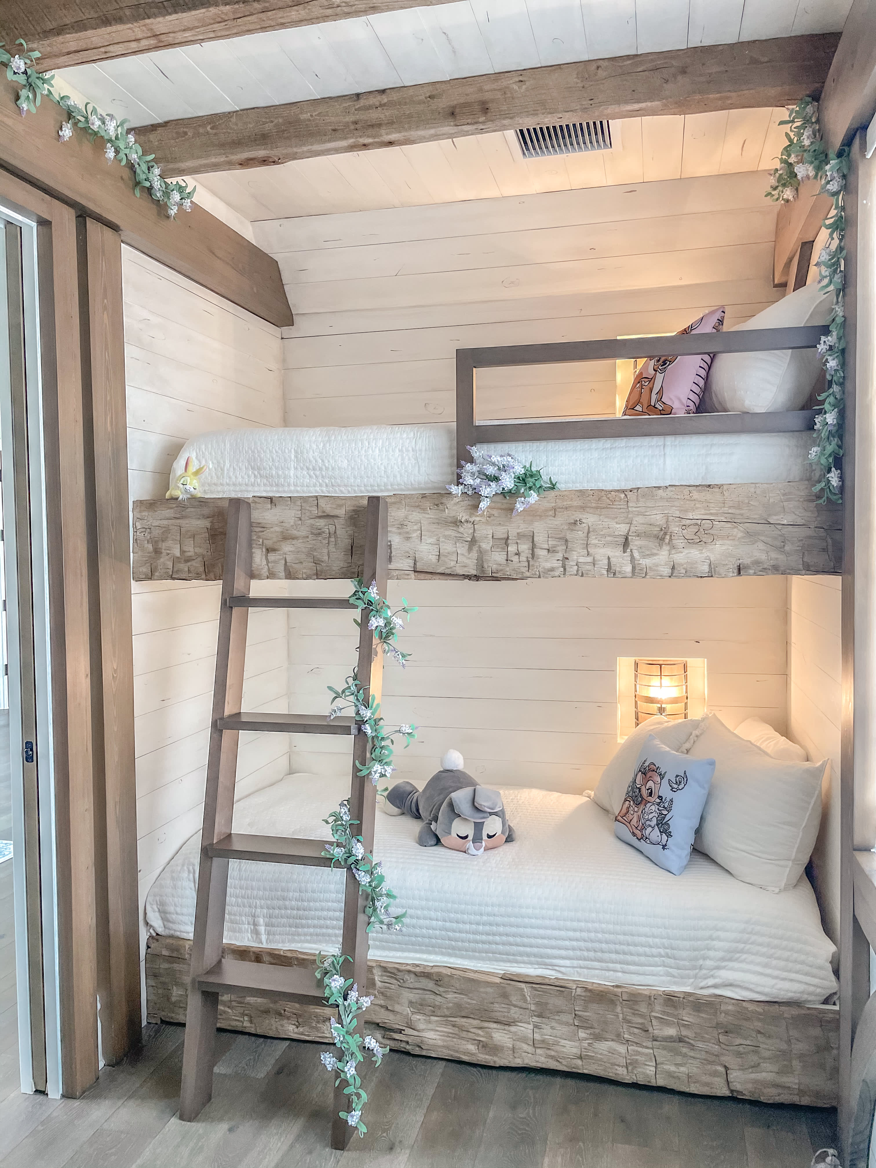 The cozy bunk beds in this "Bambi"-themed room makes it a family favorite.