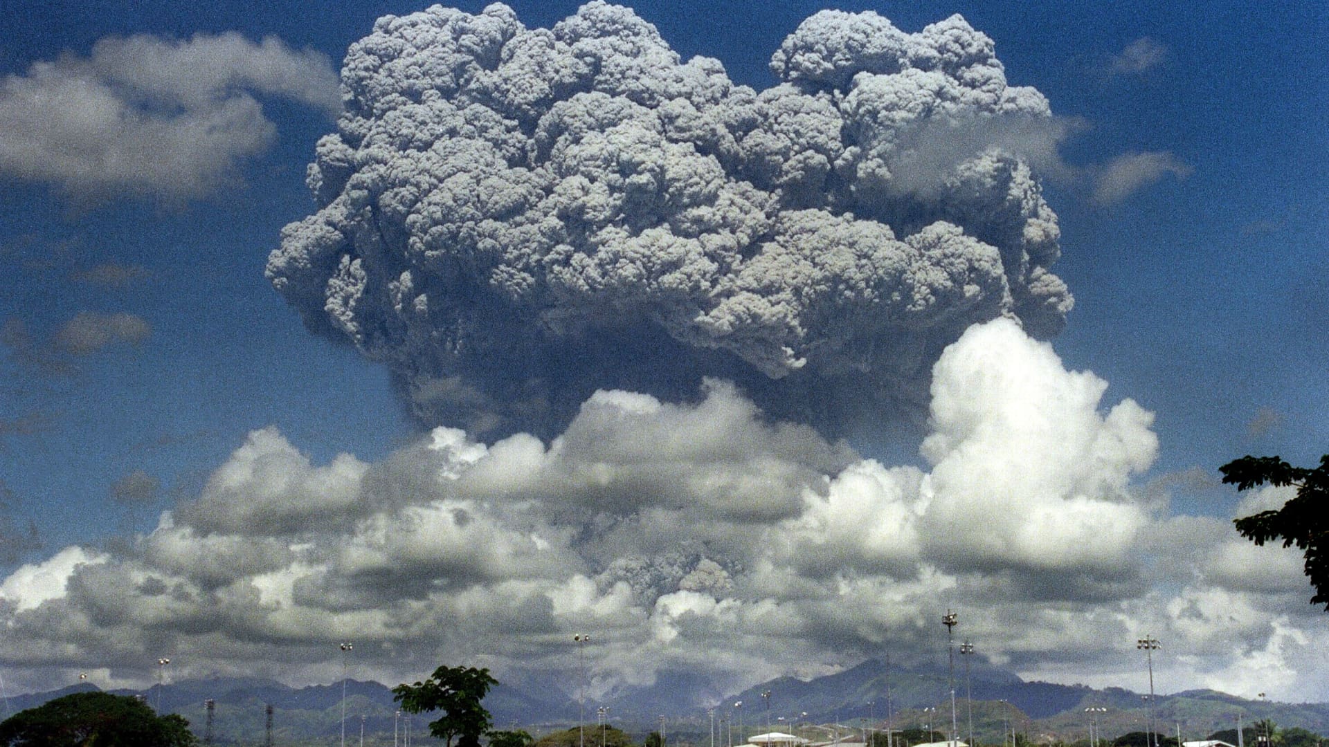 A giant volcanic mushroom cloud explodes some 20 kilometers high from Mount Pinatubo above almost deserted US Clark Air Base, on June 12, 1991 followed by another more powerful explosion. The eruption of Mount Pinatubo on June 15, 1991 was the second largest volcanic eruption of the twentieth century.