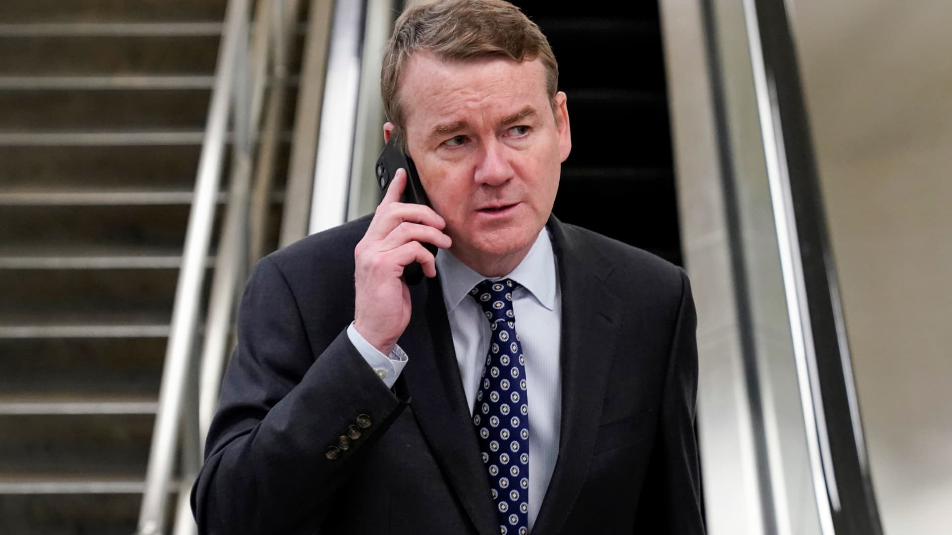 Senator Michael Bennet (D-CO) speaks on a mobile phone after a vote the day after the shooting at Robb Elementary School in Uvalde, Texas, on Capitol Hill in Washington, May 25, 2022.
