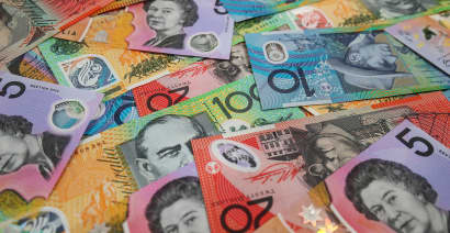 U.S. dollar rises on global growth worries; Aussie down