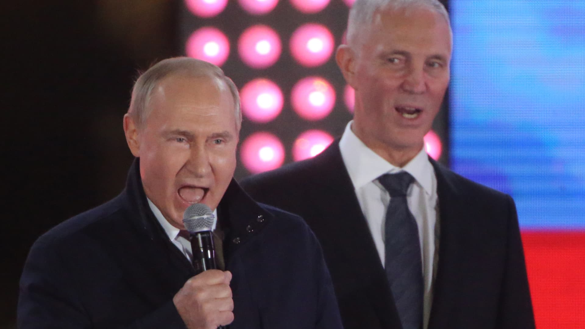 Russian President Vladimir Putin speaks as separatist leader Vladimir Saldo of the Kherson region listens during a concert in support of the annexation of four Ukrainian regions at Red Square on Sept. 30, 2022 in Moscow, Russia.