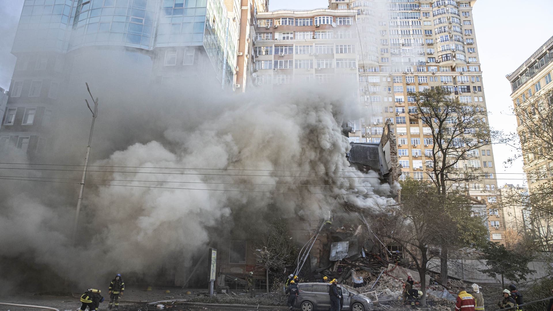 Firefighters at a destroyed building after Russian attacks in Kyiv, Ukraine on Oct. 17, 2022.