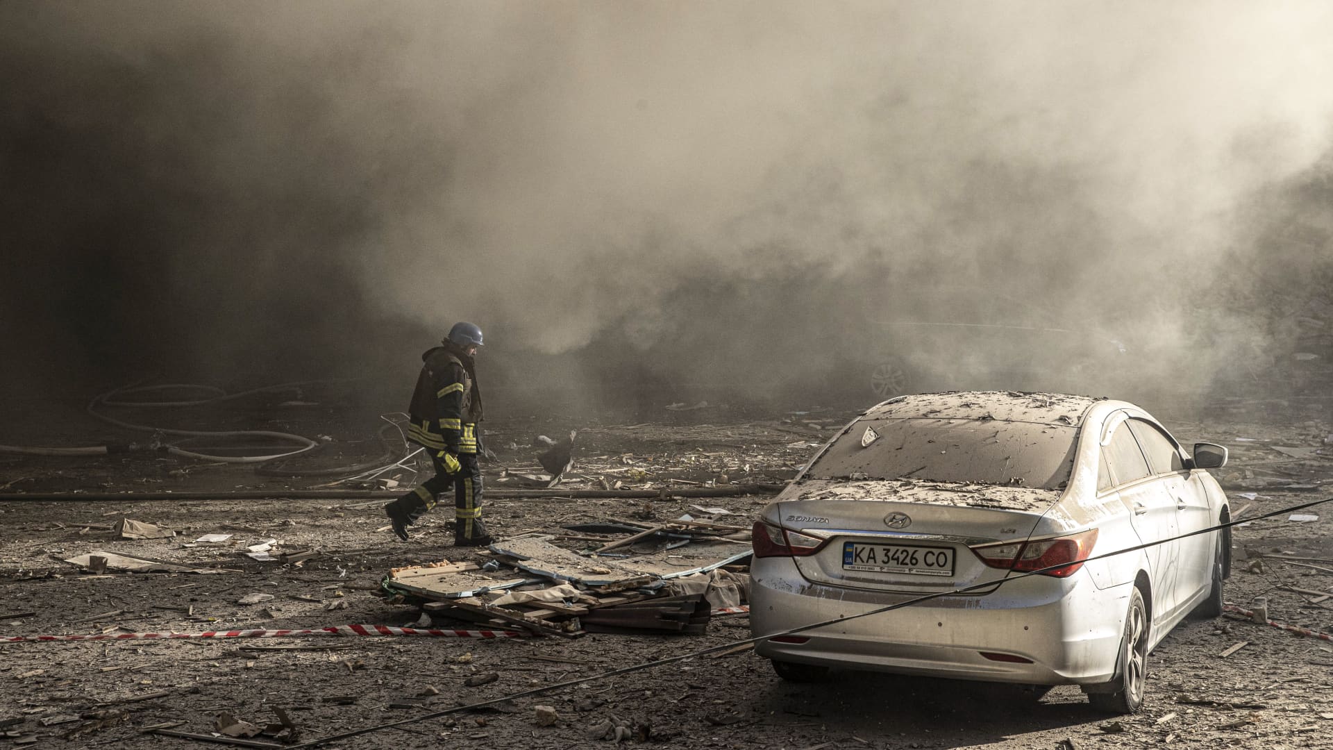 Firefighters conduct work after the Russian drone attacks in Kyiv, Ukraine on October 17, 2022. At least 4 separate explosions were heard in Kyiv, while authorities reported that the attacks were carried out with kamikaze drones.