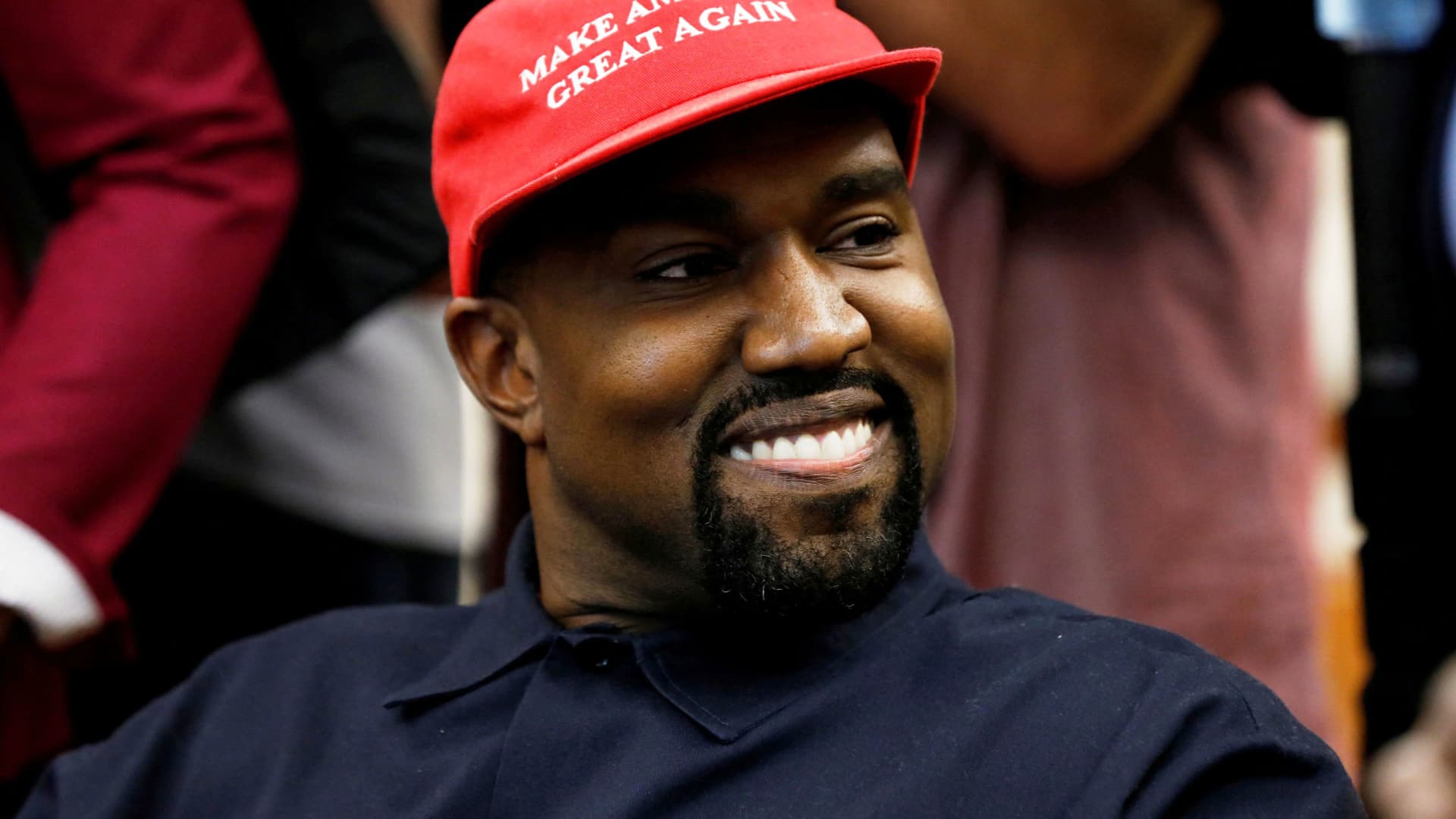 Rapper Kanye West smiles during a meeting with US President Donald Trump to discuss criminal justice reform at the White House in Washington, October 11, 2018.