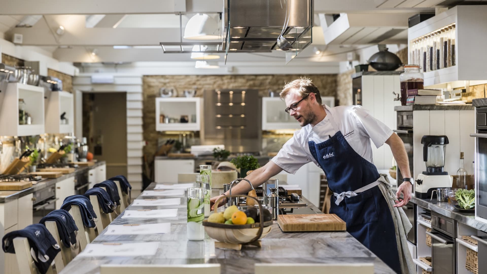 A chef prepares the table at the Daylesford cooking school in the U.K.'s Cotswolds region.