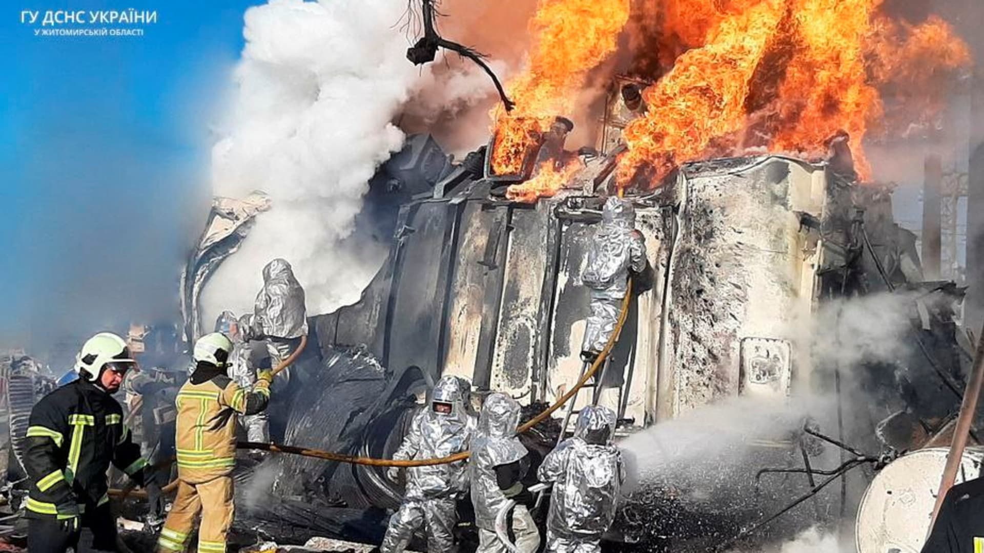 Firefighters work to put out a fire in an energy infrastructure facility, damaged by a Russian missile strike, as Russia's attack on Ukraine continues, in Zhytomyr, Ukraine, October 18, 2022.