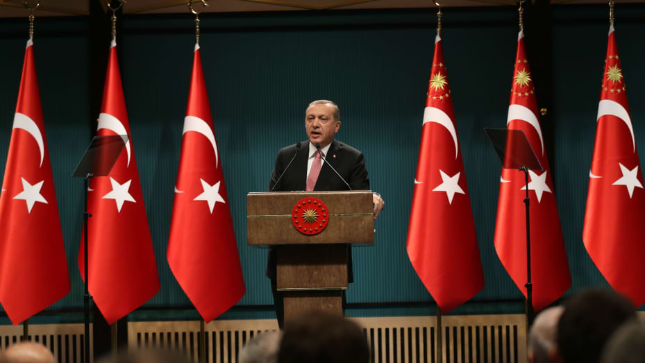 Turkish President Tayyip Erdogan declaring a three-month state of emergency and vowing to hunt down the "terrorist" group behind the 2016 coup attempt during a news conference following the National Security Council and cabinet meetings at the Presidential Palace in Ankara, Turkey, July 20, 2016. Following the coup, a newsroom crackdown ensued and a series of trials against journalists were launched.