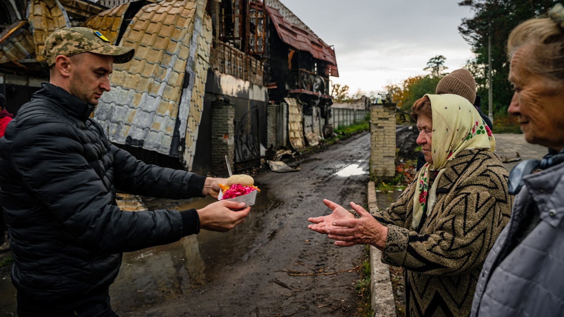 Local residents receive food and humanitarian aid in Svyatohirs'k, Donetsk region, on October 20, 2022, after the liberation of the area.