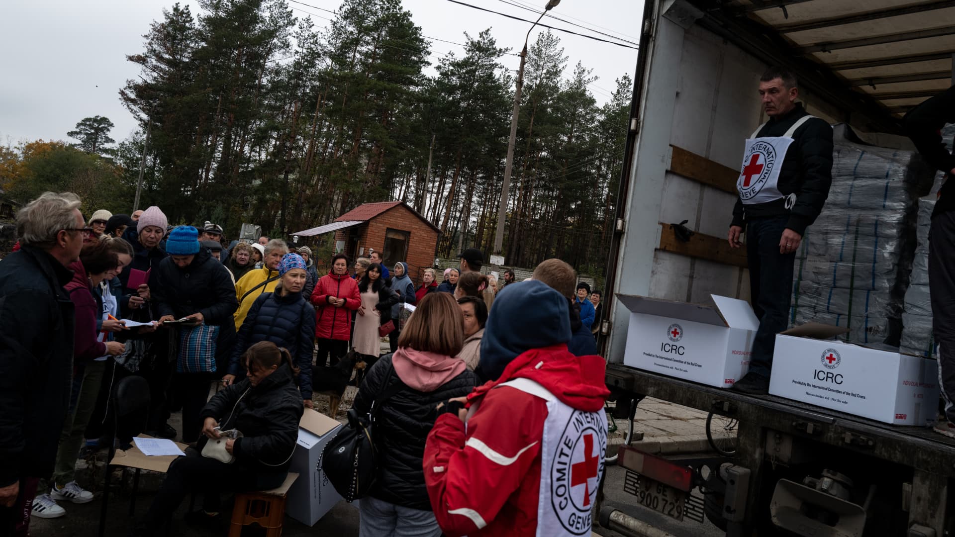 Ukrainian civilians queue for humanitarian aid provided by the Red Cross as people try to survive amid the wave of Russia's missile strikes in Sviatohiersk, Donetsk Oblast, Ukraine on October 20, 2022. 