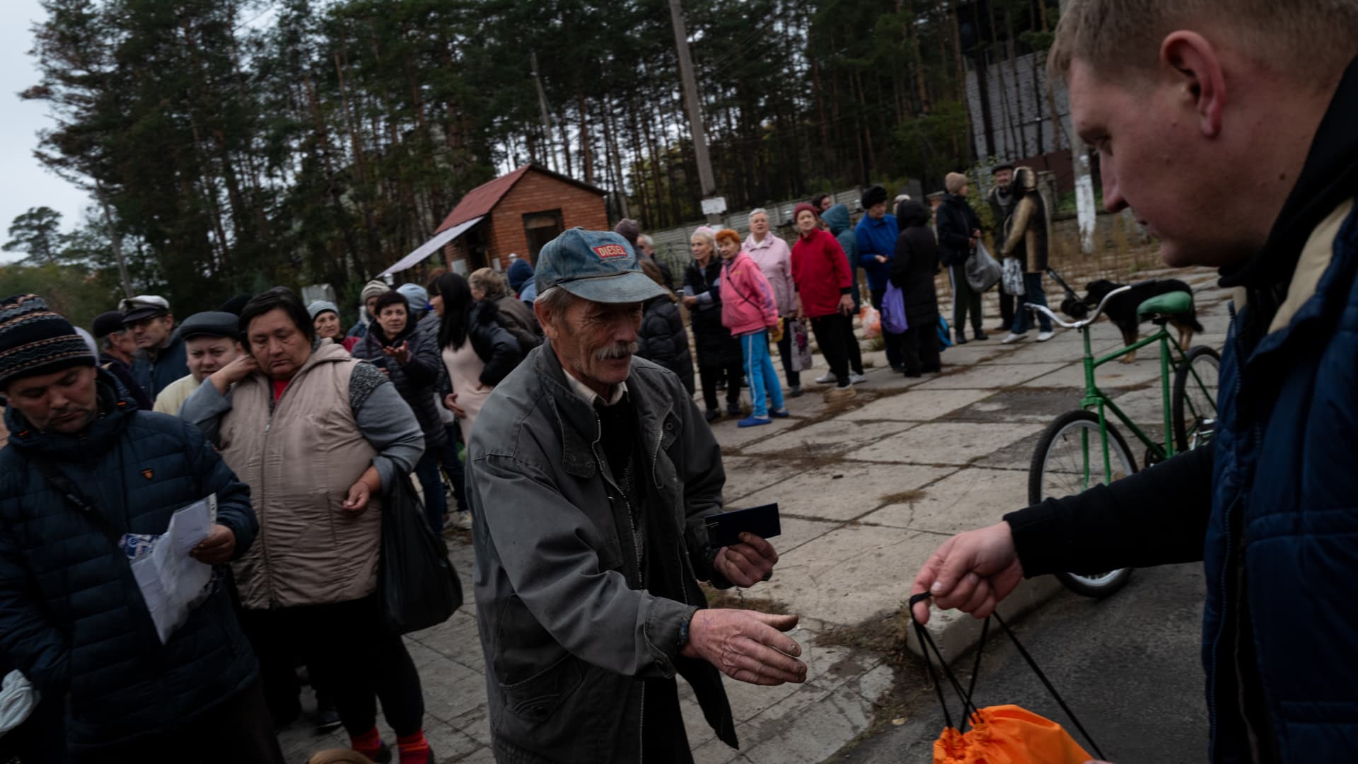 Ukrainian civilians queue for humanitarian aid provided by the Red Cross as people try to survive amid the wave of Russia's missile strikes in Sviatohiersk, Donetsk Oblast, Ukraine on October 20, 2022. 