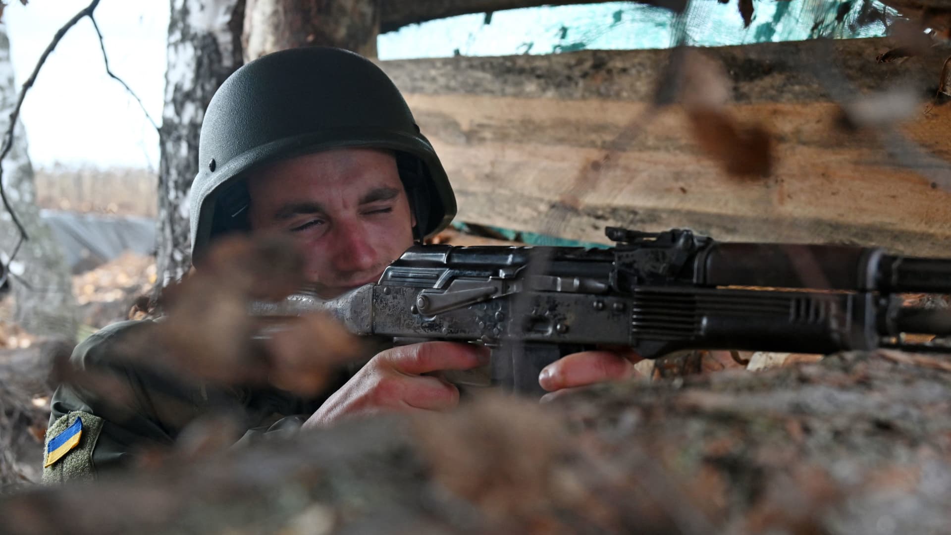 A soldier of the National Guard of Ukraine takes position in a trench in the northern occupied territories of Kharkiv region on October 21, 2022, amid the Russian military invasion of Ukraine.