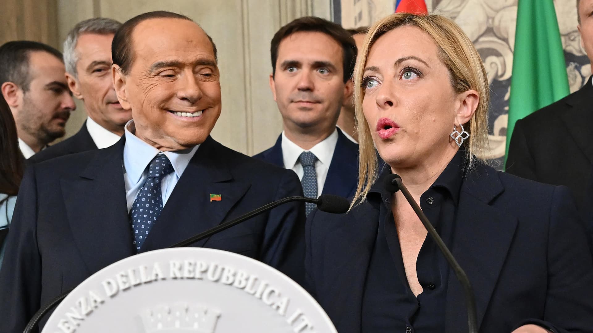 President of the Italian party Fratelli d'Italia (Brothers of Italy) Giorgia Meloni next to former Prime Minister and leader of Forza Italia (FI) party Silvio Berlusconi (L), addresses the media after a meeting with Italian President Sergio Mattarella for the first round of formal political consultations for new government at the Quirinale Palace in Rome on October 21, 2022.