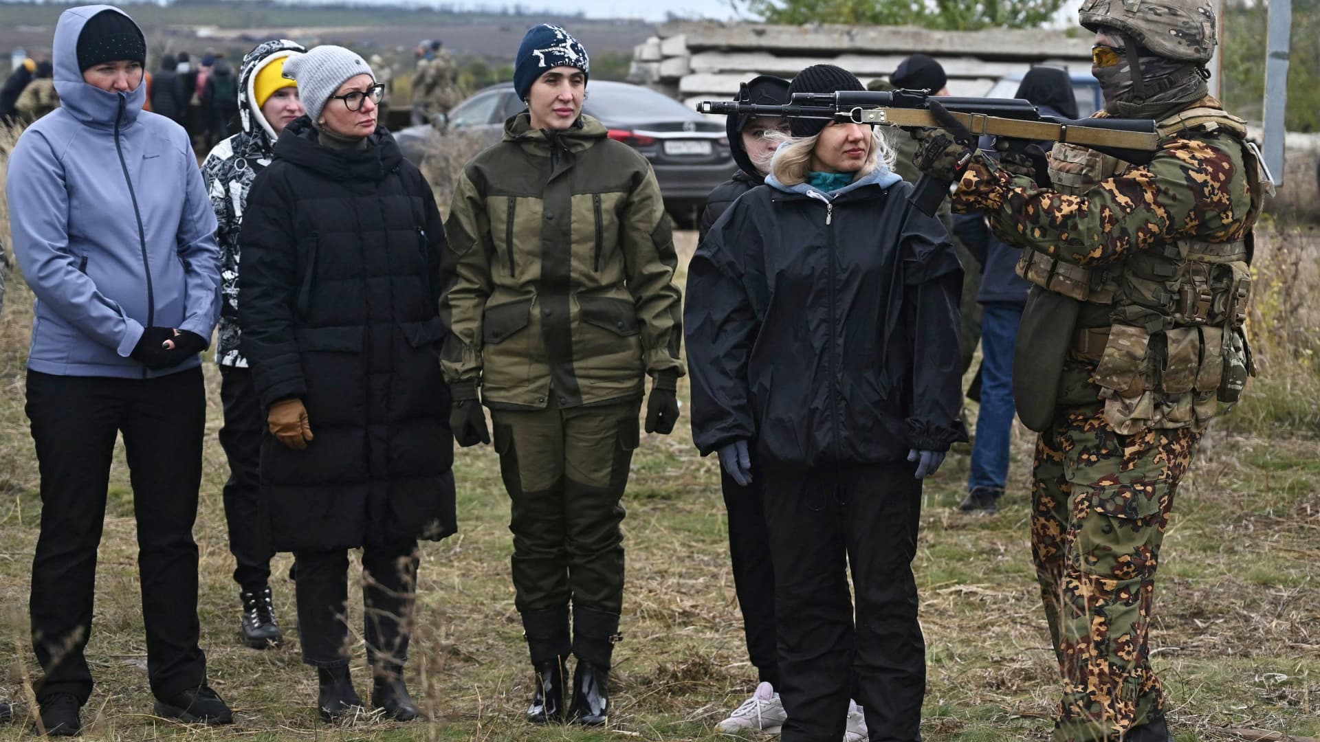 Participants listen to the instructor during a combat training session for civilians organised by local authorities at a range in Rostov Region, Russia October 21, 2022.