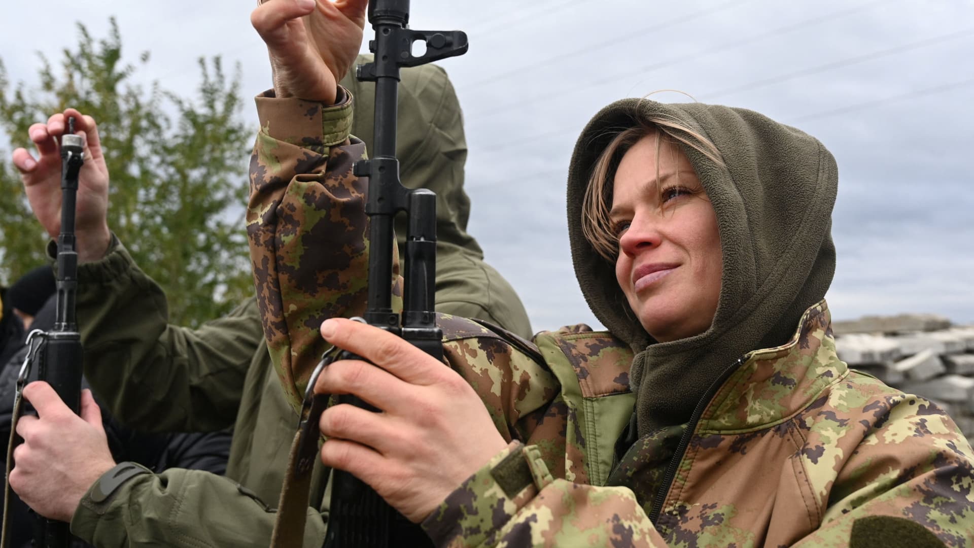 A woman assembles a rifle during a combat training session for civilians organised by local authorities at a range in Rostov Region, Russia October 21, 2022.