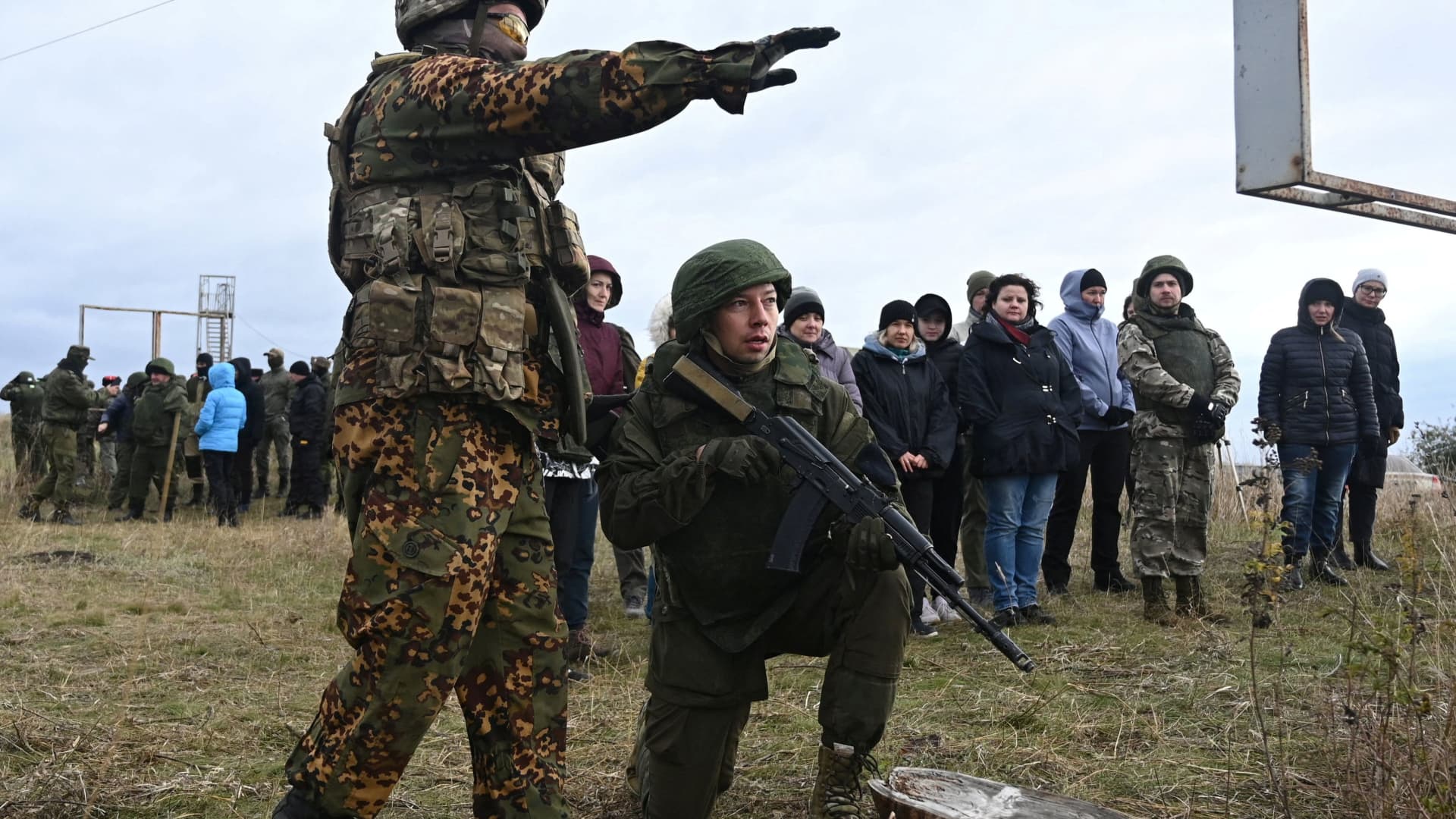 Participants listen to the instructor during a combat training session for civilians organized by local authorities at a range in Rostov Region, Russia October 21, 2022.