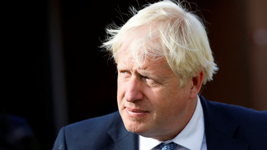 Boris Johnson flies back to Britain to attempt rapid comeback