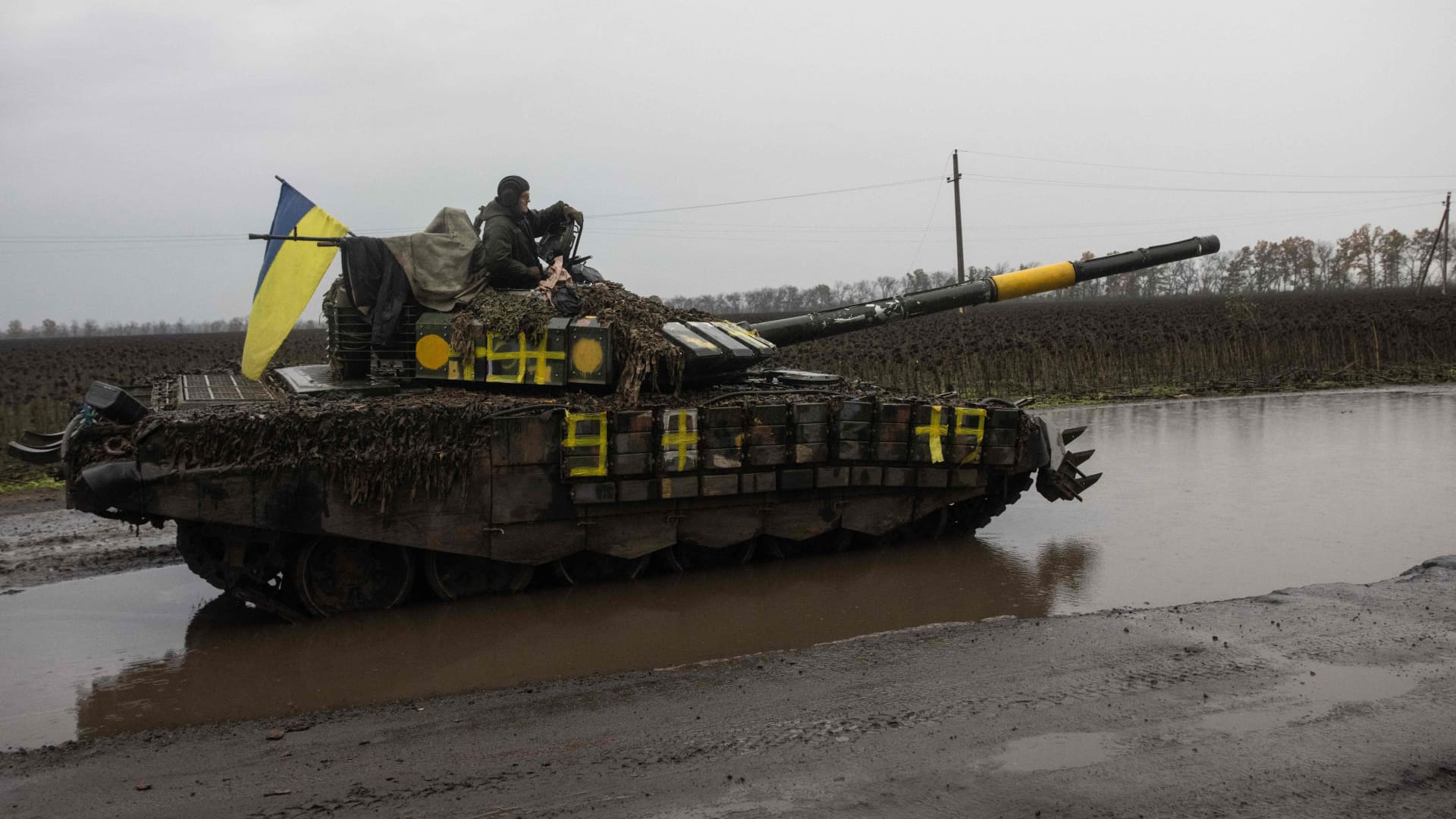 A Ukrainian serviceman stands on a tank near Borivske, Kharkiv region on October 23, 2022.