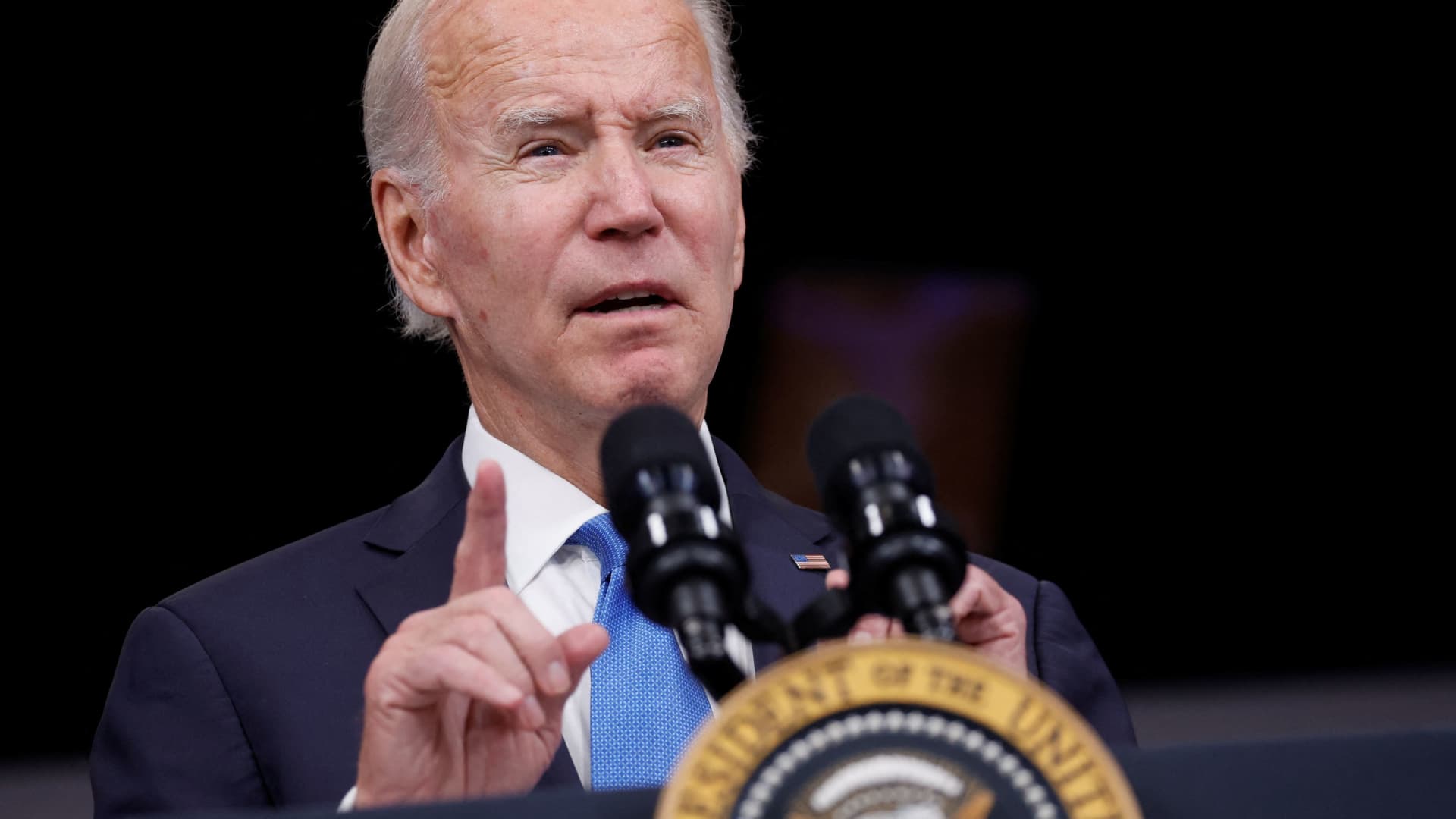 U.S. President Joe Biden delivers remarks while launching a new plan for Americans to receive booster shots and vaccinations against the coronavirus disease (COVID-19), onstage in an auditorium on the White House campus in Washington, October 25, 2022.