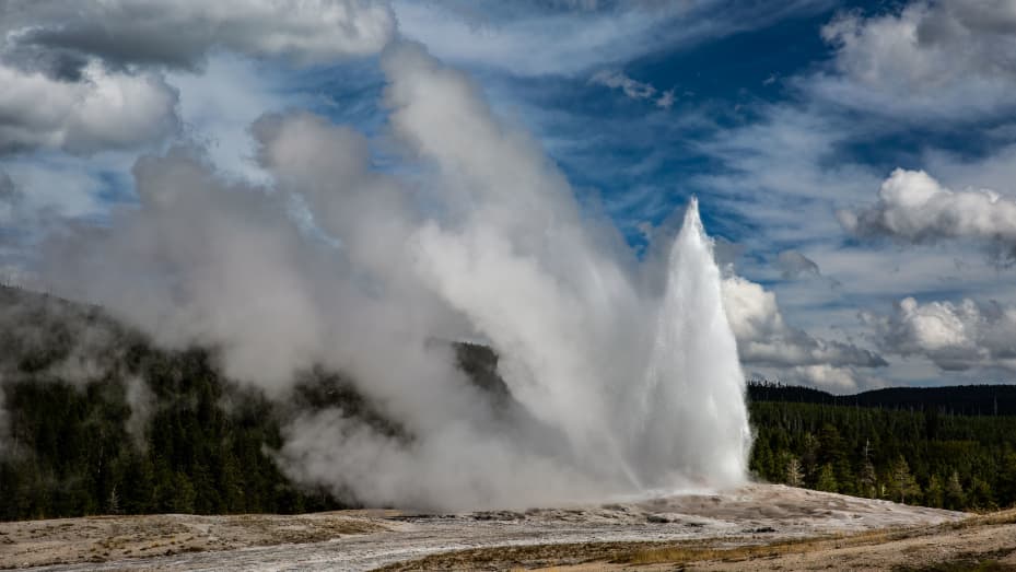 The iconic Old Faithful Geyser springs to life (every 90 minutes) in Yellowstone National Park's Upper Geyser Basin on September 18, 2022, in Yellowstone National Park, Wyoming. Sitting atop an active volcanic caldera, Yellowstone, America's first National Park, is home to more geological hydrothermal features (geysers, mud pots, hot springs, fumaroles) than are found in the rest of the world combined.