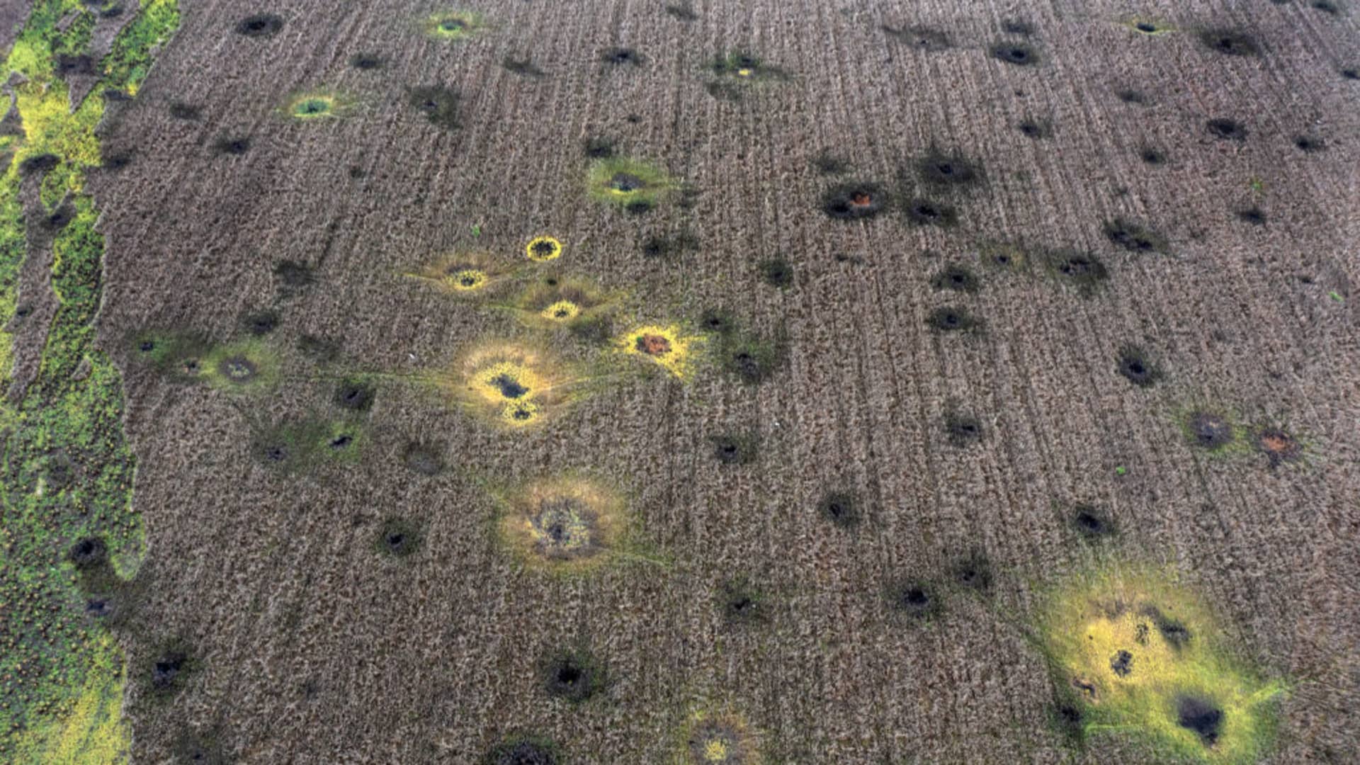 Artillery craters scar the landscape on October 24, 2022 in Sulyhivka, Kharkiv oblast, Ukraine.