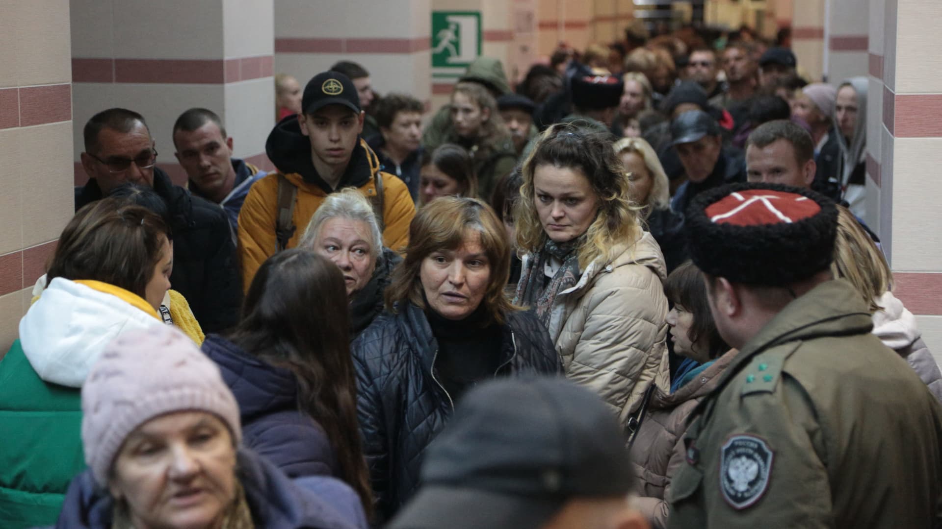 People arrived from Kherson wait for further evacuation into the depths of Russia inside the Dzhankoi's railway station in Crimea on October 21, 2022.
