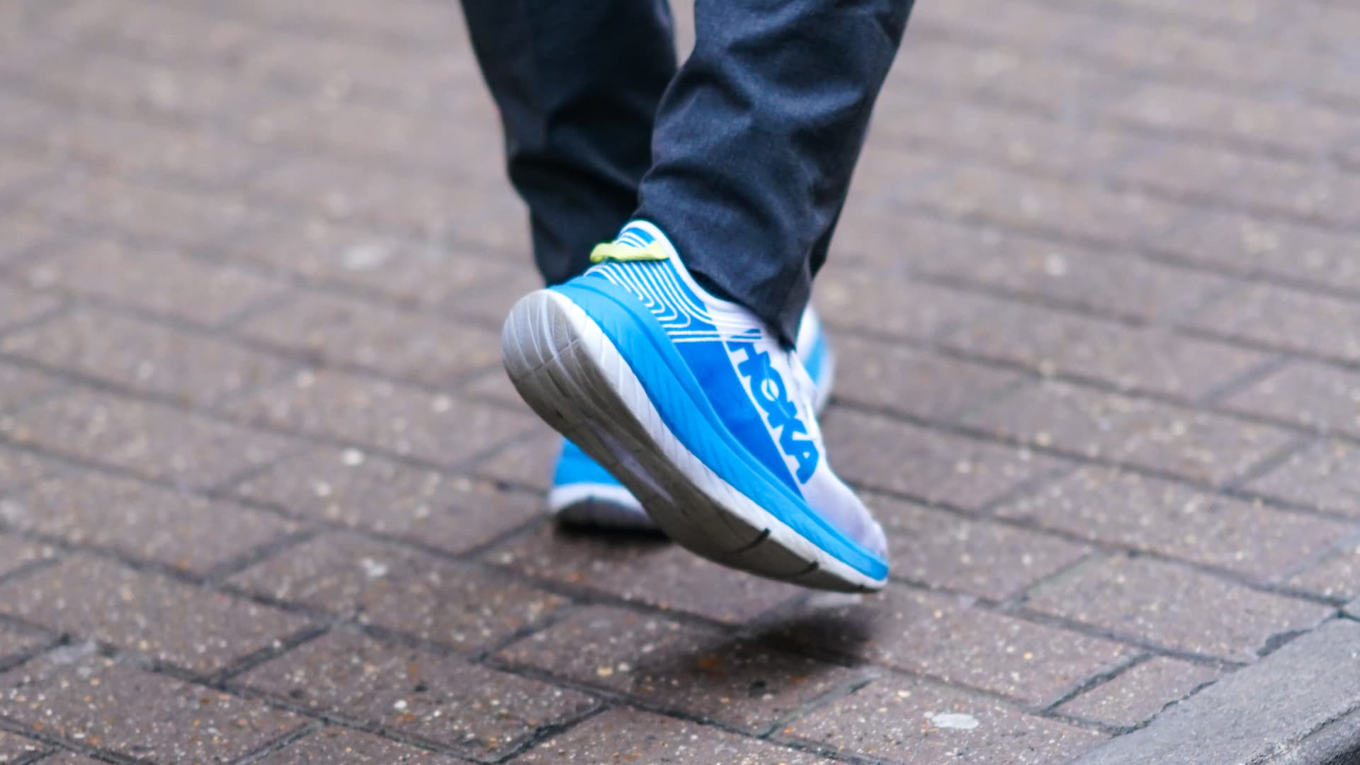 Hoka blue sneakers are seen, during London Fashion Week Men's on January 05, 2020.