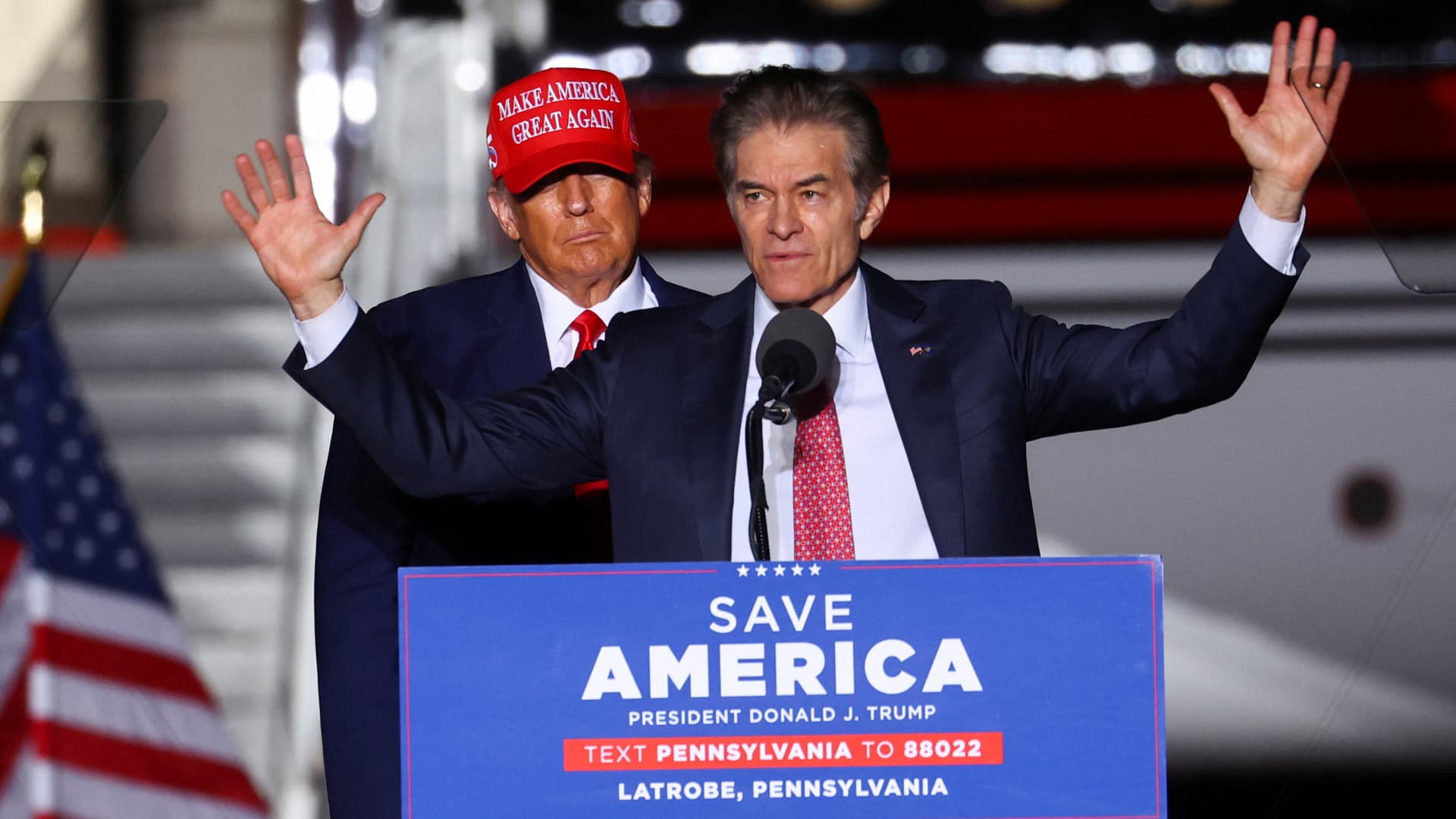 Former U.S. President Donald Trump looks on as Pennsylvania Republican U.S. Senate candidate Dr. Mehmet Oz speaks at a pre-election rally to support Republican candidates in Latrobe, Pennsylvania, U.S., November 5, 2022.