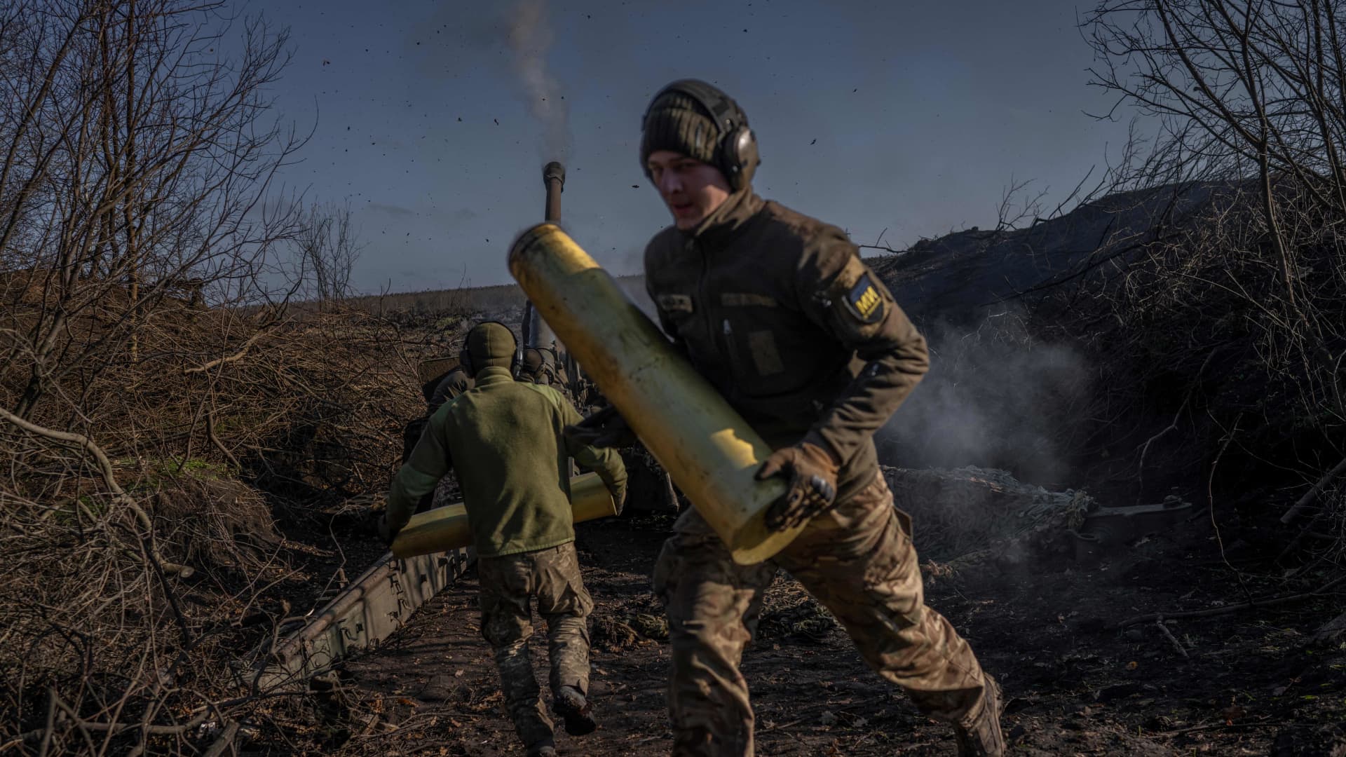 Ukrainian soldiers of an artillery unit fire toward Russian positions outside Bakhmut on Nov. 8, 2022.