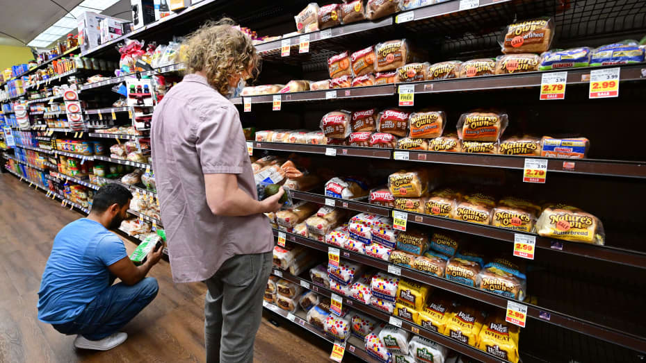 People shop for bread at a supermarket in Monterey Park, California on Oct. 19, 2022.