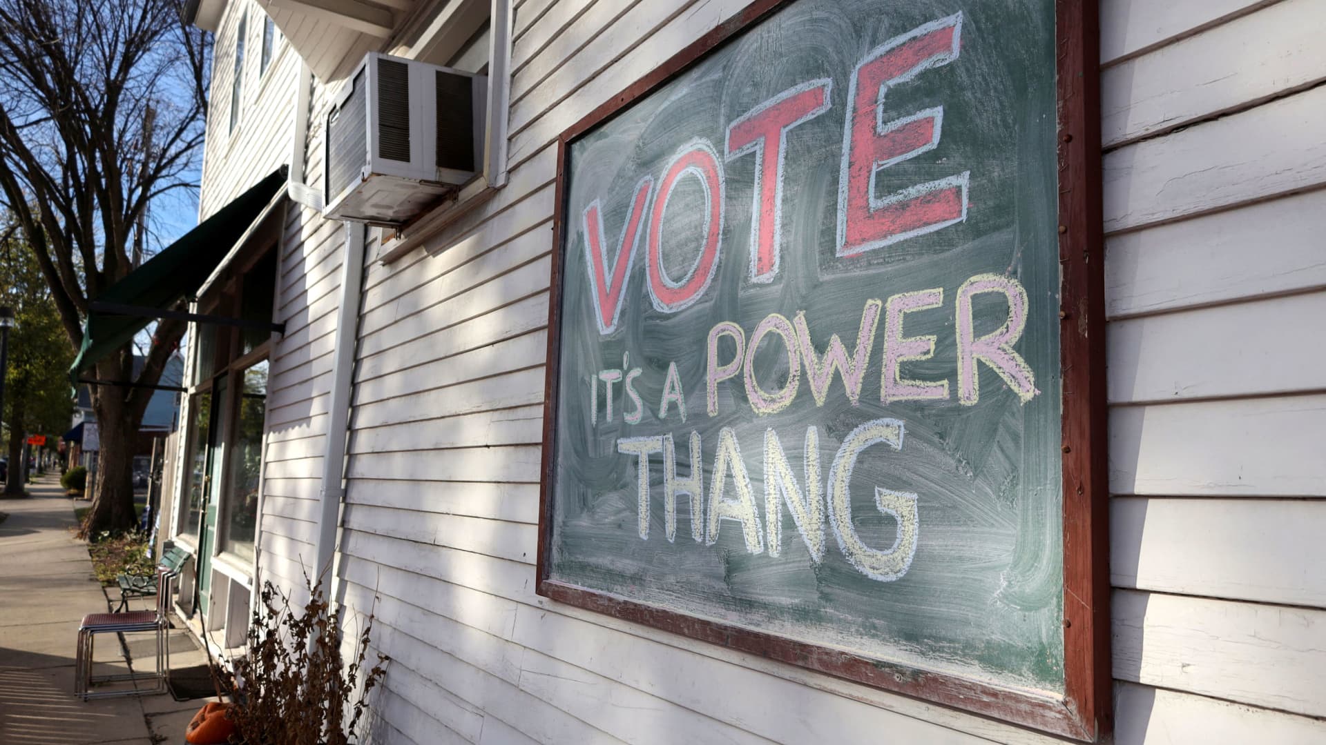 A chalkboard sign encouraging people to vote in the midterm elections hangs in Milwaukee, Wisconsin, November 8, 2022.