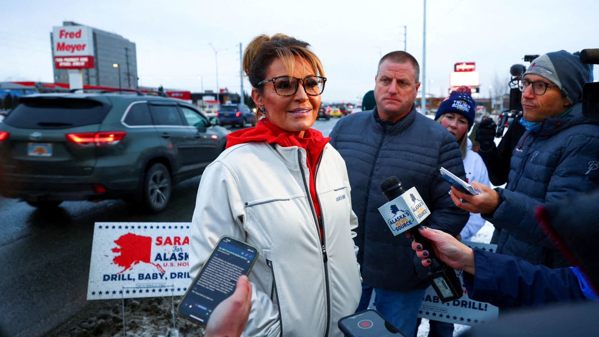 Republican candidate for the U.S. House of Representatives Sarah Palin talks with reporters near the corner of Seward Highway and Northern Lights Boulevard on U.S. election night, in Anchorage, Alaska, U.S. November 8, 2022. 