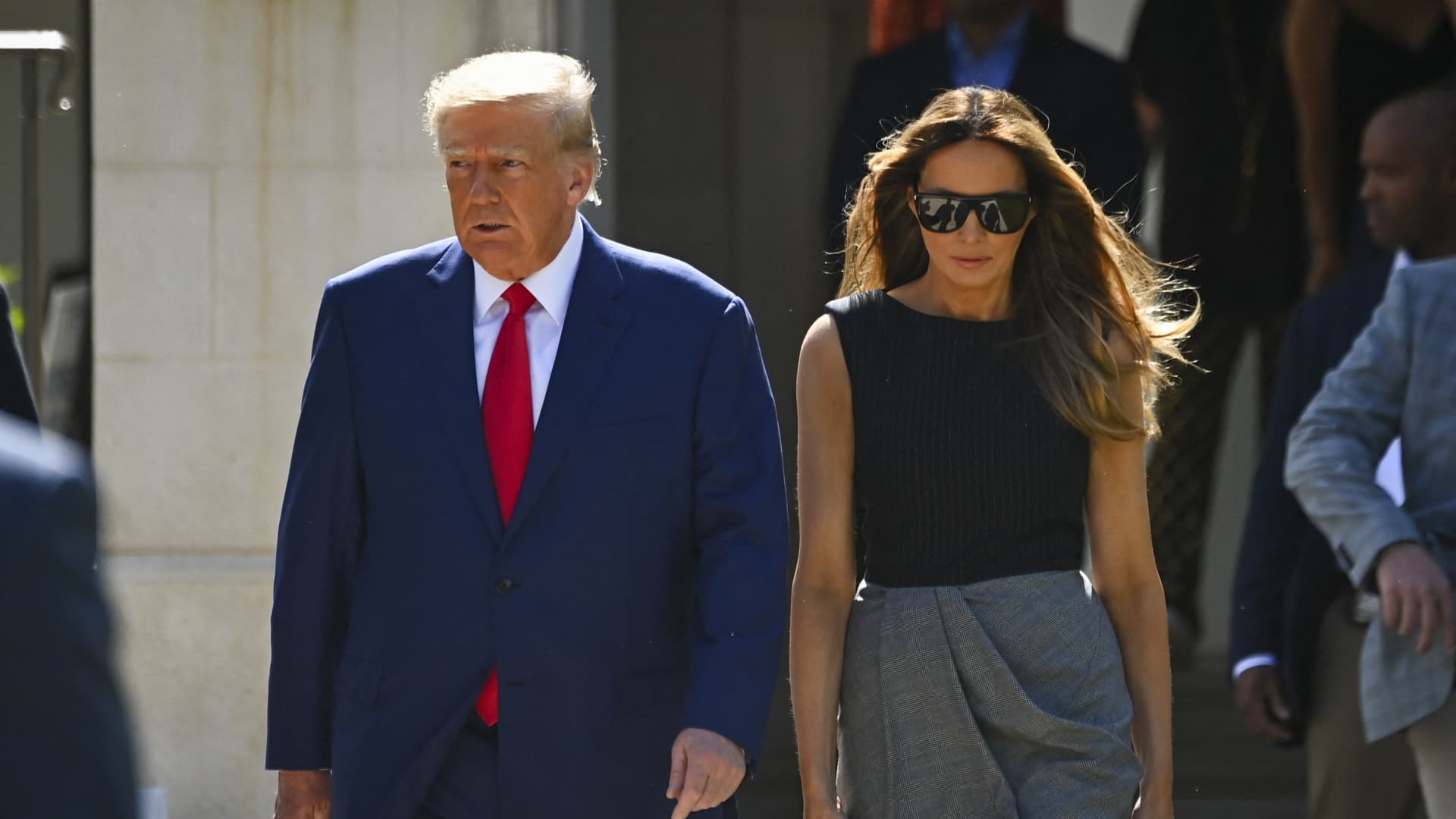 Former US President Donald Trump and his wife, Melania Trump, leave a polling station after voting in the US midterm elections in Palm Beach, Florida, on November 8, 2022.
