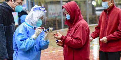 China eases Covid measures, trims quarantine time by two days