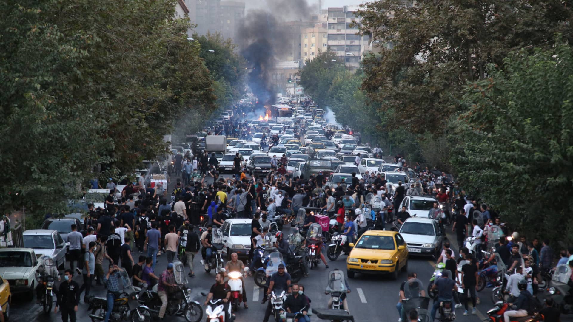 Iranian demonstrators take to the streets of the capital Tehran during a protest for Mahsa Amini on Sept. 21, days after she died in police custody.