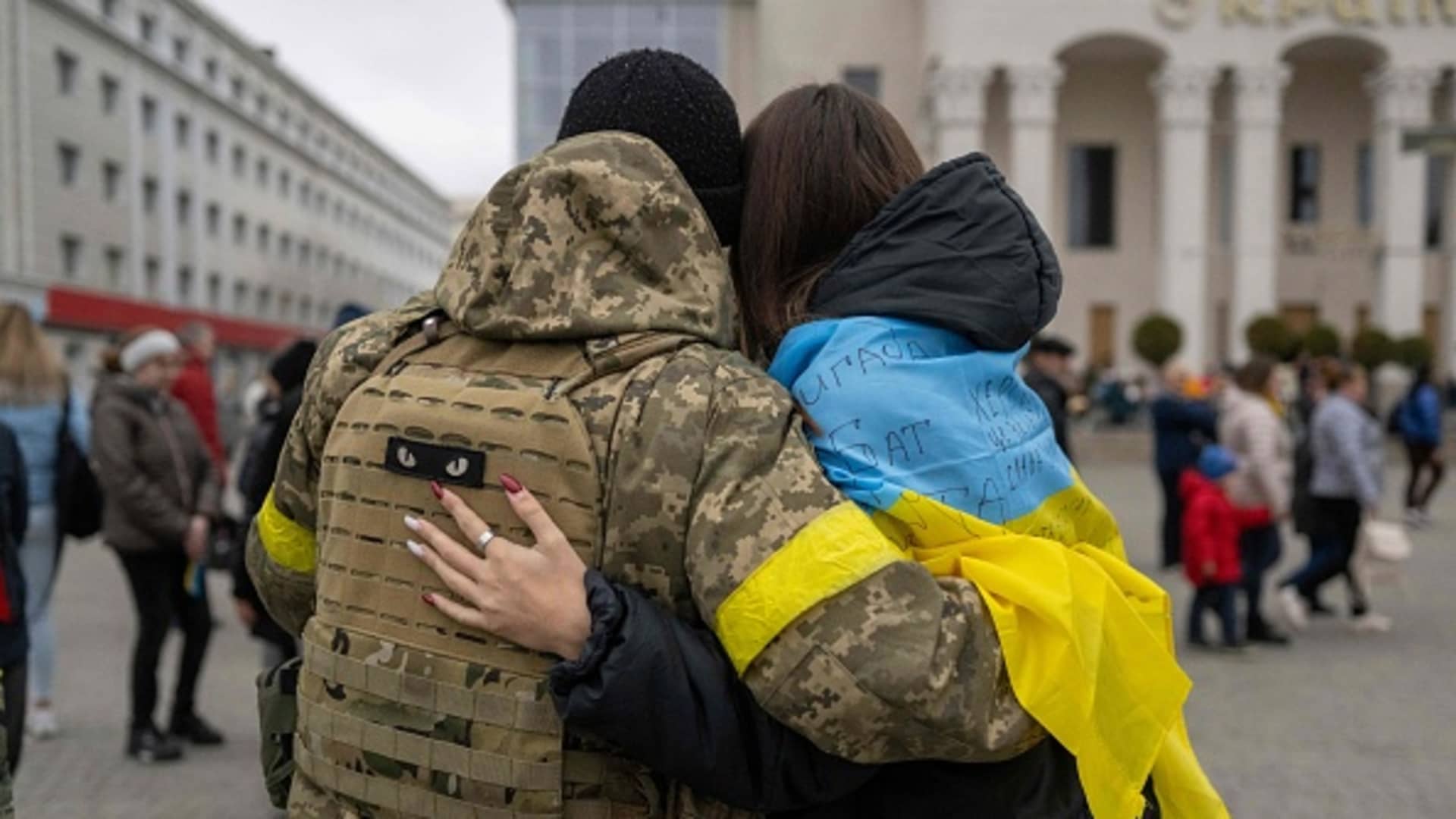 A woman hugs a Ukrainian soldier as local residents gather to celebrate the liberation of Kherson, on Nov. 13, 2022, amid Russia's invasion of Ukraine.