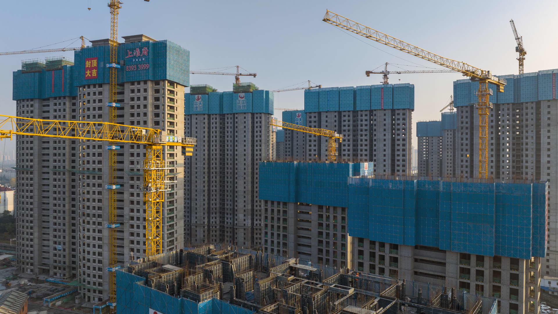 Chinese real estate stocks surged this month. But analyst warns of  'weak reality' vs. high expectations