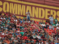A general view of fans in front of the Washington Commanders logo during the first half of the game between the Washington Commanders and the Philadelphia Eagles at FedExField on September 25, 2022 in Landover, Maryland.
