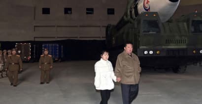 Kim Jong Un reveals his daughter to the world at latest ballistic missile launch