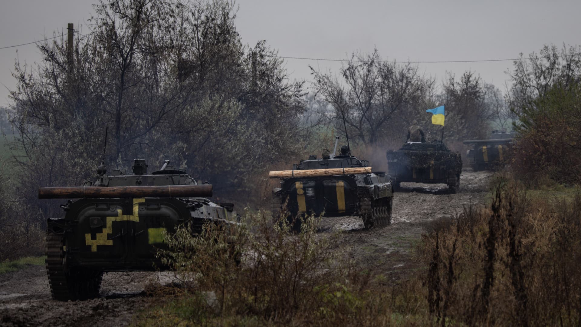 A column of Ukrainian BMP-2 vehicles navigate a muddy road in Kherson region on November 20, 2022 in Kherson, Ukraine.