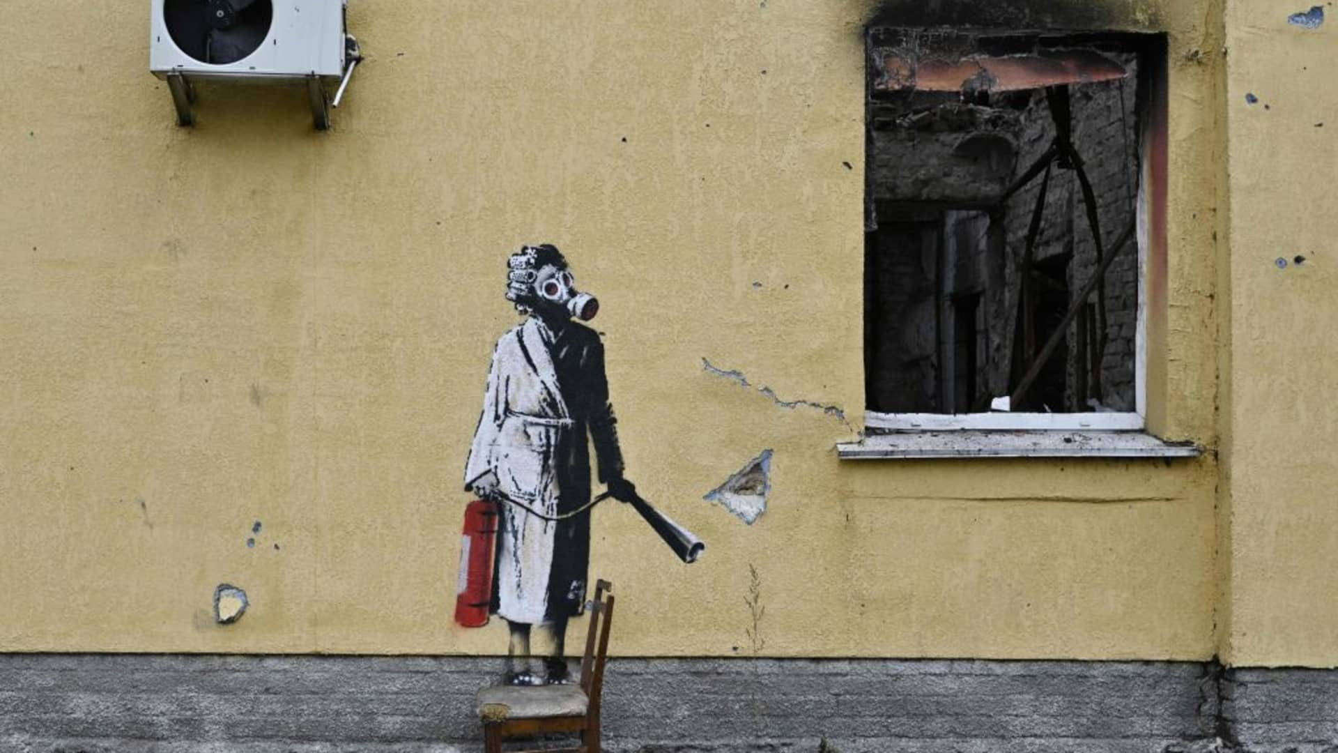 This photograph taken on November 16, 2022 shows a graffiti made by Banksy on the wall of a destroyed building in the town of Gostomel, near Kyiv, amid the Russian invasion of Ukraine. 