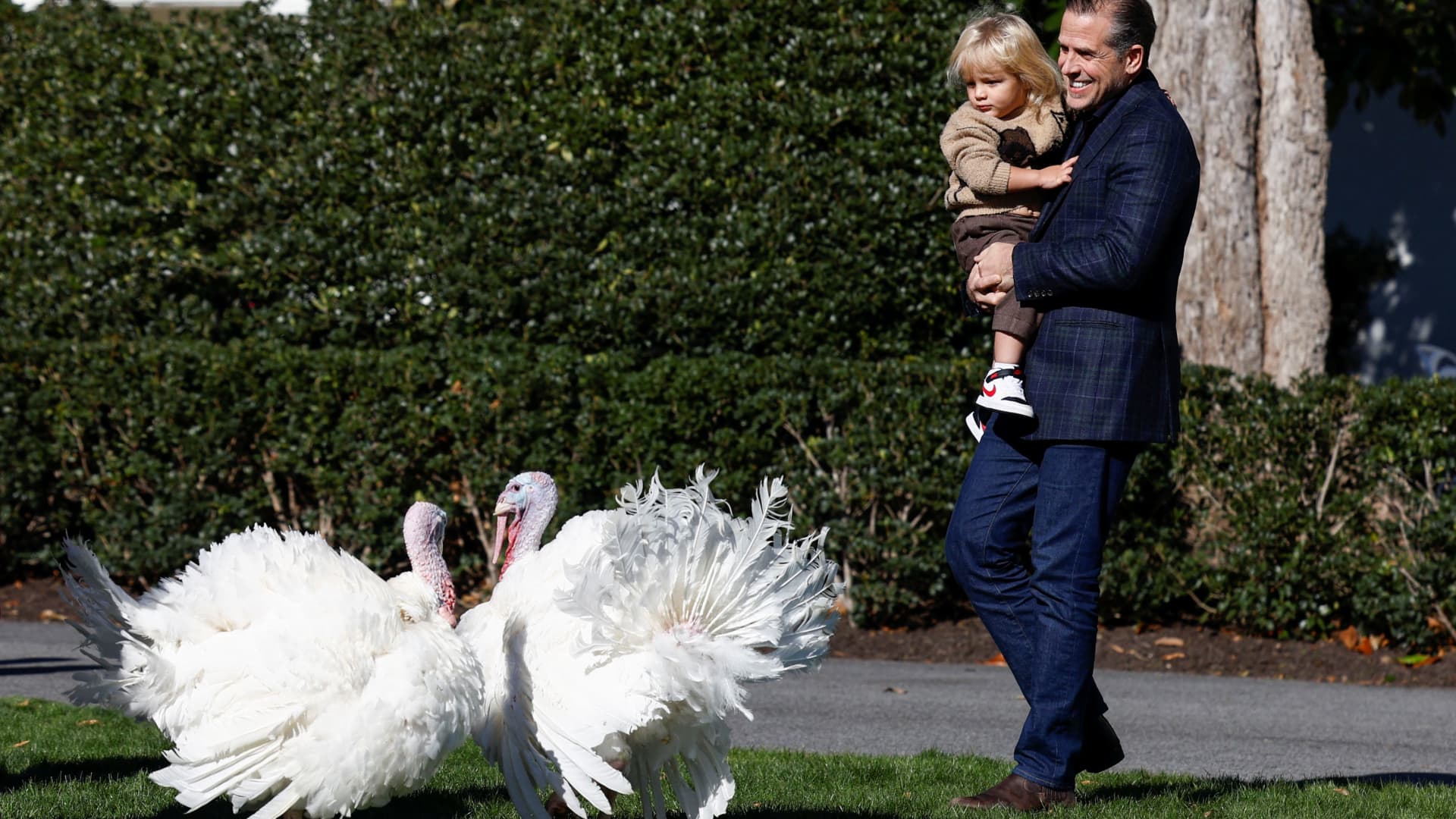 Hunter Biden and his son Beau Biden attend the annual ceremony to pardon Chocolate and Chip, the National Thanksgiving Turkeys on the South Lawn of the White House, in Washington, U.S., November 21, 2022. 