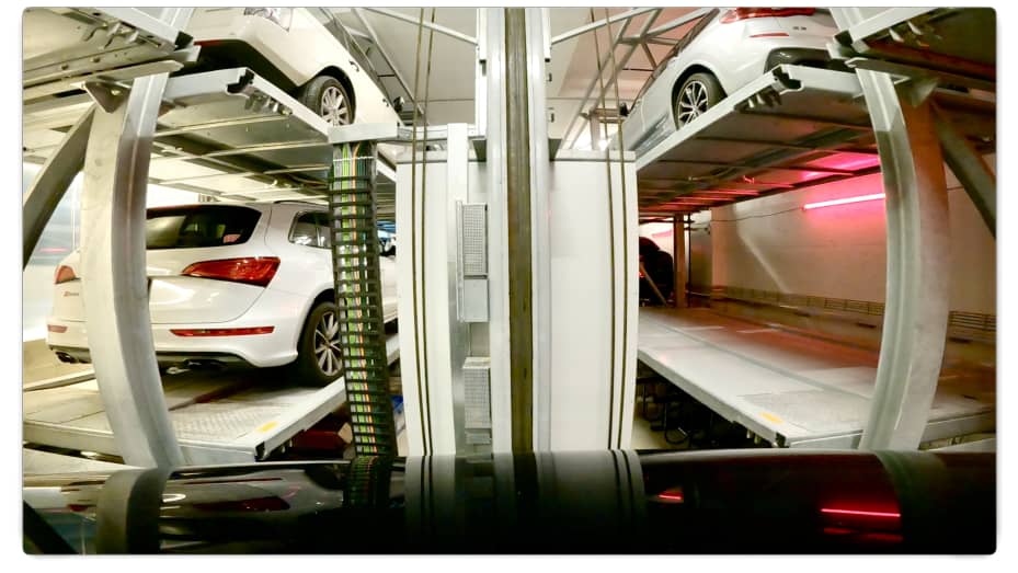 The view inside the robo-parking machine at 121 E 22nd St reveals a system of pallets and hydraulic lifts that maneuver cars around a two-tier subterranean parking structure.