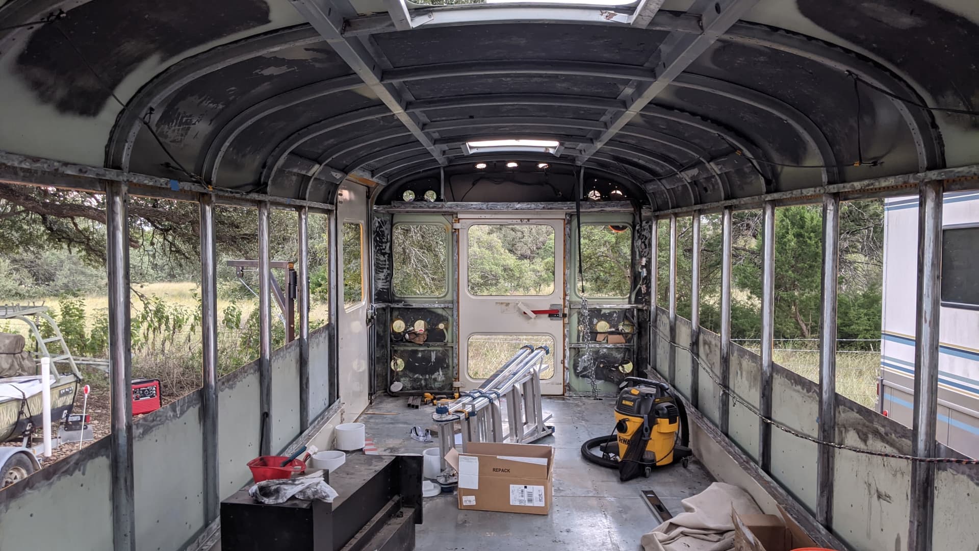 Everdeen and Jay bought their school bus from a government auction in January 2020. It cost them around $85,000 to renovate it into a customized living space.